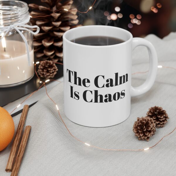 14632789125687999983_2048.jpeg The calm is chaos mug
